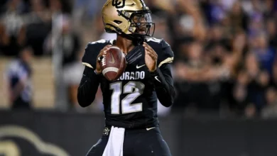 Quarterback Brendon Lewis #12 of the Colorado Buffaloes sets to pass against the TCU