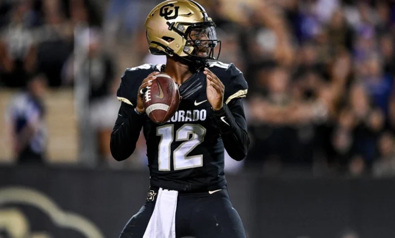 Quarterback Brendon Lewis #12 of the Colorado Buffaloes sets to pass against the TCU