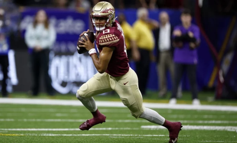 Quarterback Jordan Travis #13 of the Florida State Seminoles throws a pass against the LSU