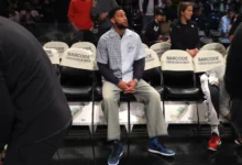 Ben Simmons of the Brooklyn Nets looks on from the bench