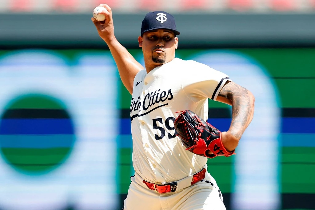 Christian Vázquez #8 of the Minnesota Twins hits a walk-off solo home run against the Houston Astros in the ninth inning at Target Field on July 07, 2024 in Minneapolis, Minnesota. The Twins defeated the Astros 3-2