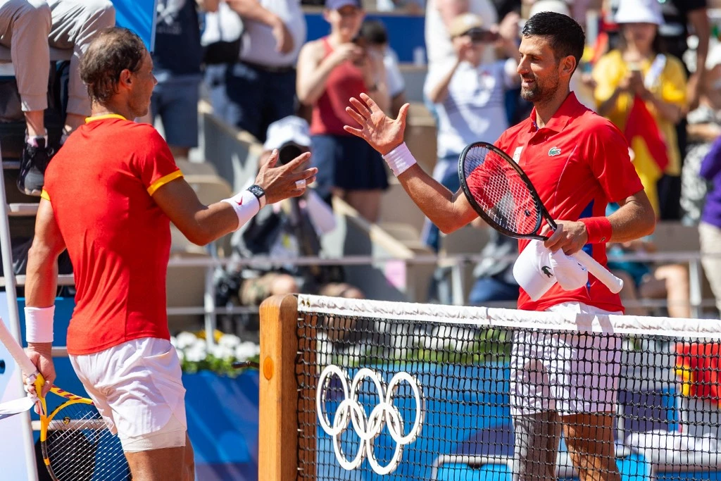 Rafael Nadal and Novak Djokovic thank each oth after the Men's Singles Second Round match on the Olympic Games Paris 2024 at Roland Garros in Paris, France on July 29, 2024.