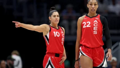 Kelsey Plum #10 and A'ja Wilson #22 of the Las Vegas Aces look on during the first quarter against the Seattle Storm at Climate Pledge Arena on July 10, 2024 in Seattle, Washington