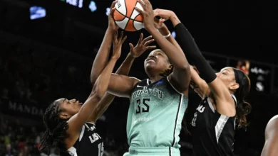 onquel Jones #35 of the New York Liberty puts up a shot against Tiffany Hayes #15 and A'ja Wilson #22 of the Las Vegas Aces in the first half at Michelob ULTRA Arena on August 17, 2024 in Las Vegas, Nevada. The Liberty defeated the Aces 79-67.